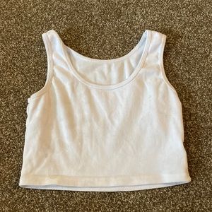 It is a cropped tank top, it is size Small, and it is white.